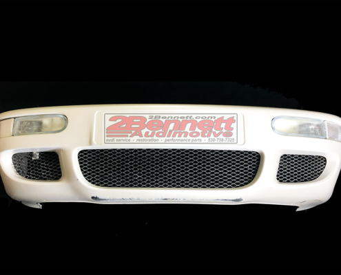 Audi RS2 bumper assembly OEM complete with mounts, gills, lights, signals, and Pearl White paint 2Bennett Audimotive